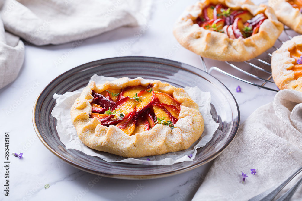 Homemade seasonal summer fruit galette, tart, pie with nectarines, peaches Homemade seasonal summer fruit galette, tart, pie with nectarines, peaches