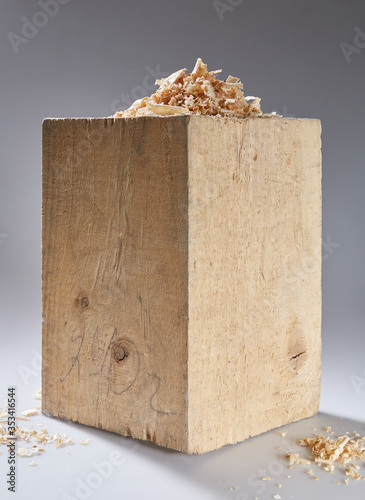 Fényképezés wooden cube with shavings on a gray background