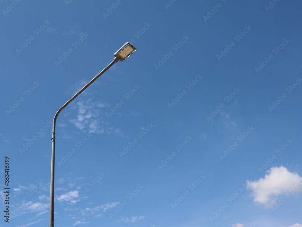 The lamp illuminates the street at night, looks like a tall pole, the background is a bright sky
The lamp illuminates the street at night, looks like a tall pole, the background is a bright sky