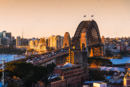 Sydney harbour bridge, Landscape view of Sydney city skyline with Sydney harbour bridge north shore in sunset sky, Australia.