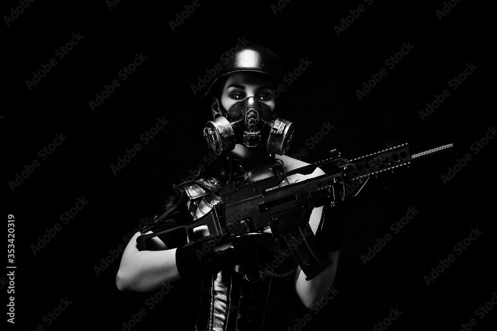 Portrait of a female cyborg soldier wearing a gas mask, helmet and an assault rifle Portrait of a female cyborg soldier wearing a gas mask, helmet and an assault rifle