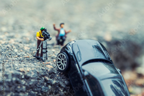 A film crew shooting a blockbuster scene. Macro photo with shallow depth of field. photo