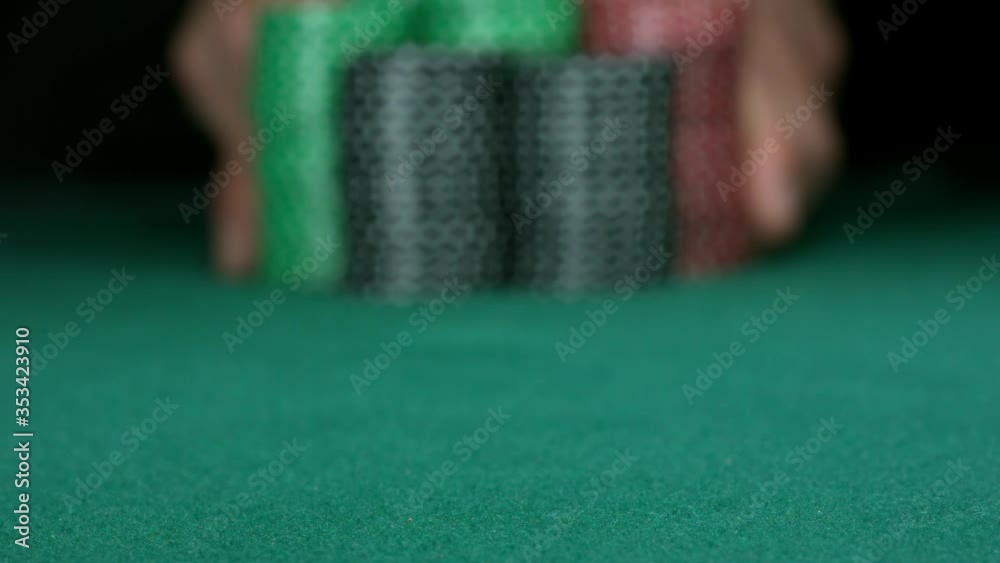 ALL IN! Stack of poker chips falling toward camera. Slow motion 1000fps full HD.
