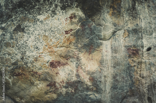 Ancient paintings painted by prehistoric people on the cliffs showing various stories of that era.