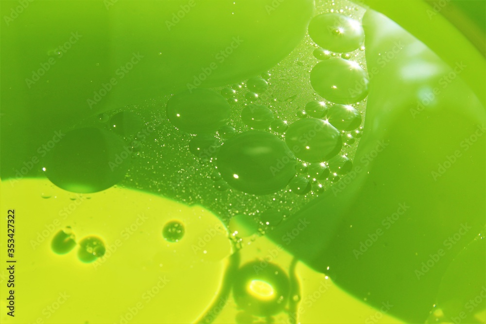 abstract green bubbles of oil with water background