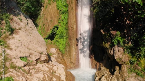 4K Aerial View of Himalayan Waterfall amongst Natural Surroundings situated at Devbhoomi Rishikesh, Uttarakhand, India. Cinematic Drone Shot Slowly Revealing the Waterfall and Nature. photo