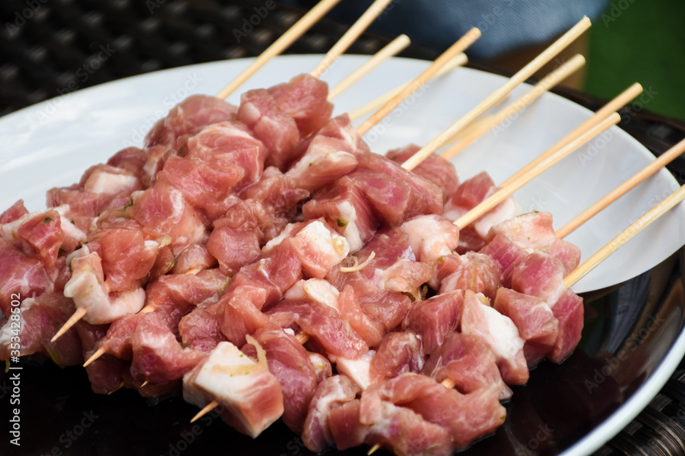 Raw marinated pork meat skewer ready for grill.