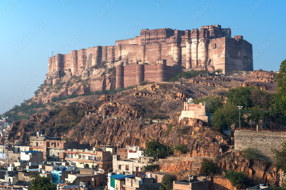 .India, Jodhpur, city scape at sunset of Blue city and Mehrangarh Fort a UNESCO World Heritage Site with Jaswant Thada in the foreground.