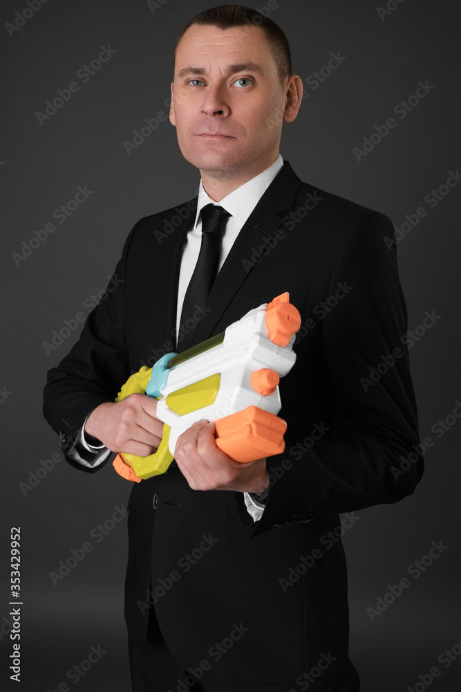 Portrait of an attractive young businessman in black background wearing suit and necktie. Classic style. Studio shot Portrait of an attractive young businessman in black background wearing suit and necktie. Classic style. Studio shot