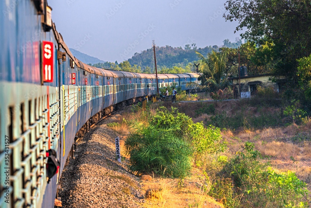 India, Maharashtra, Perspective view and curve of Indian train at the ...