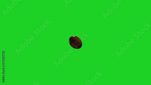 American football spinning in the air on a green screen background