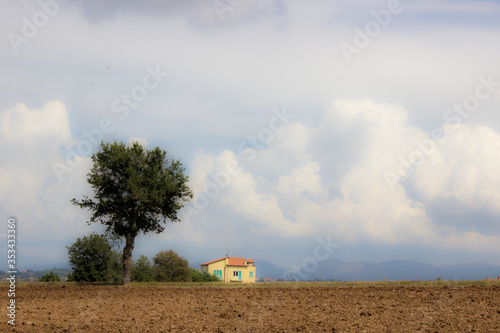 Soft scenic farmhouse with clouds