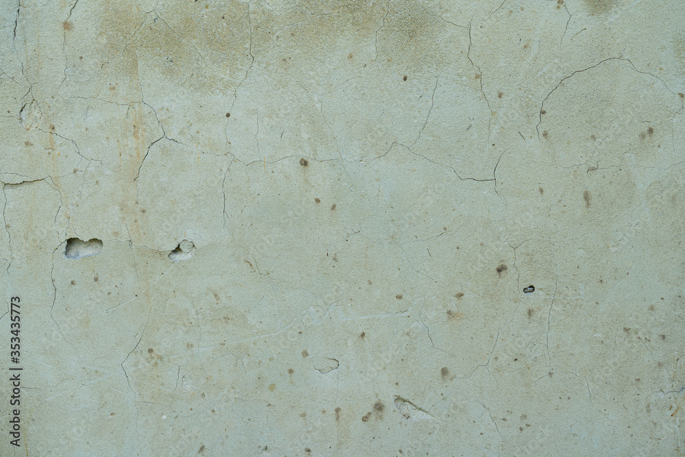 Old cracked concrete cement wall. Cracked wall. Brick wall with damage. Vintage texture style for graphic design or retro wallpaper
