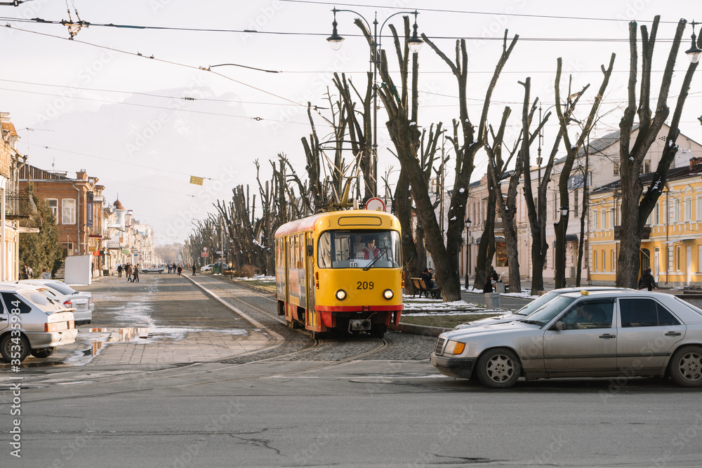 Fototapeta premium Tram rides on the street of Vladikavkaz