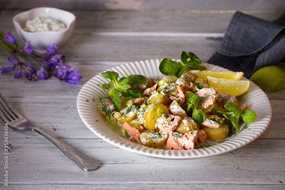 Poached Salmon salad with baby potatoes and yogurt dressing. Horizontal image Poached Salmon salad with baby potatoes and yogurt dressing. Horizontal image