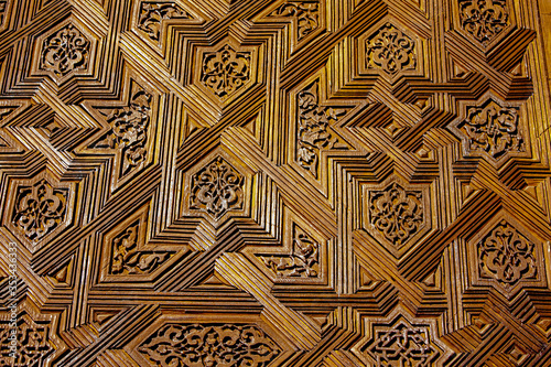 Reliefs carved on a wooden door in the Alhambra