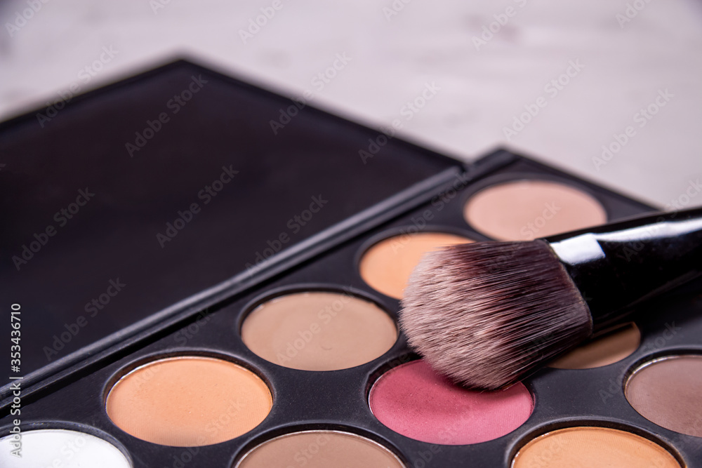 Unfolded open cosmetics on a pink background Unfolded open cosmetics on a pink background