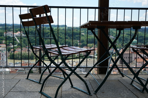 Фотография Benches and chairs at tables invite you to relax and unwind