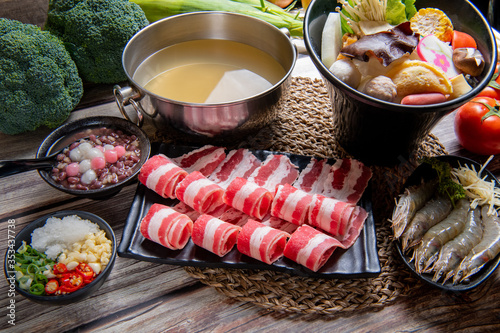 Japanese nabemono hotpot dish of thinly sliced meat and vegetables boiled in water and served with dipping sauces.