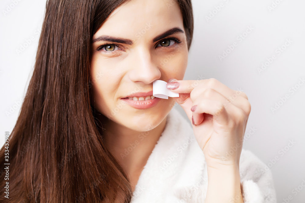 Care concept, woman holding stripe with wax to remove facial hair Care concept, woman holding stripe with wax to remove facial hair