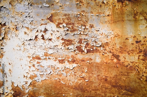 old cracked brown paint on a door with white gaps. texture, background. copy space