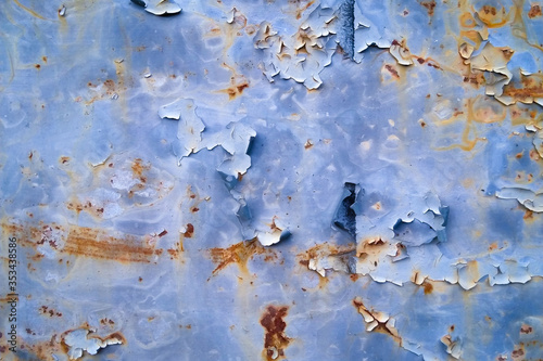 old cracked brown paint on a door with white gaps. texture, background. copy space