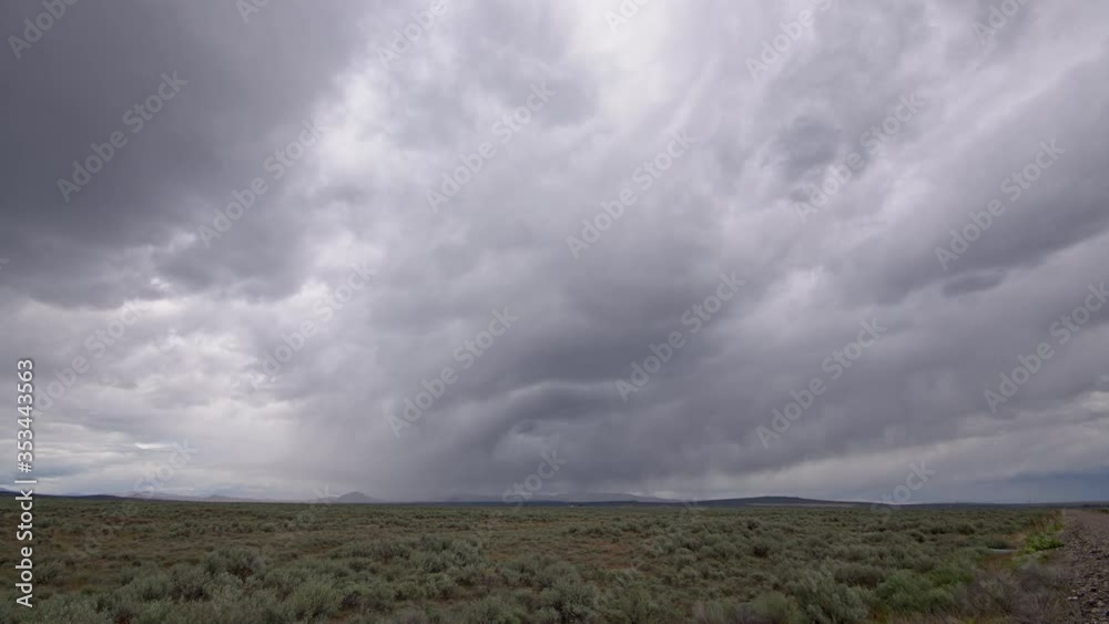 Time lapse of storm clouds moving over the Idaho landscape over field of sagebrush. Time lapse of storm clouds moving over the Idaho landscape over field of sagebrush.