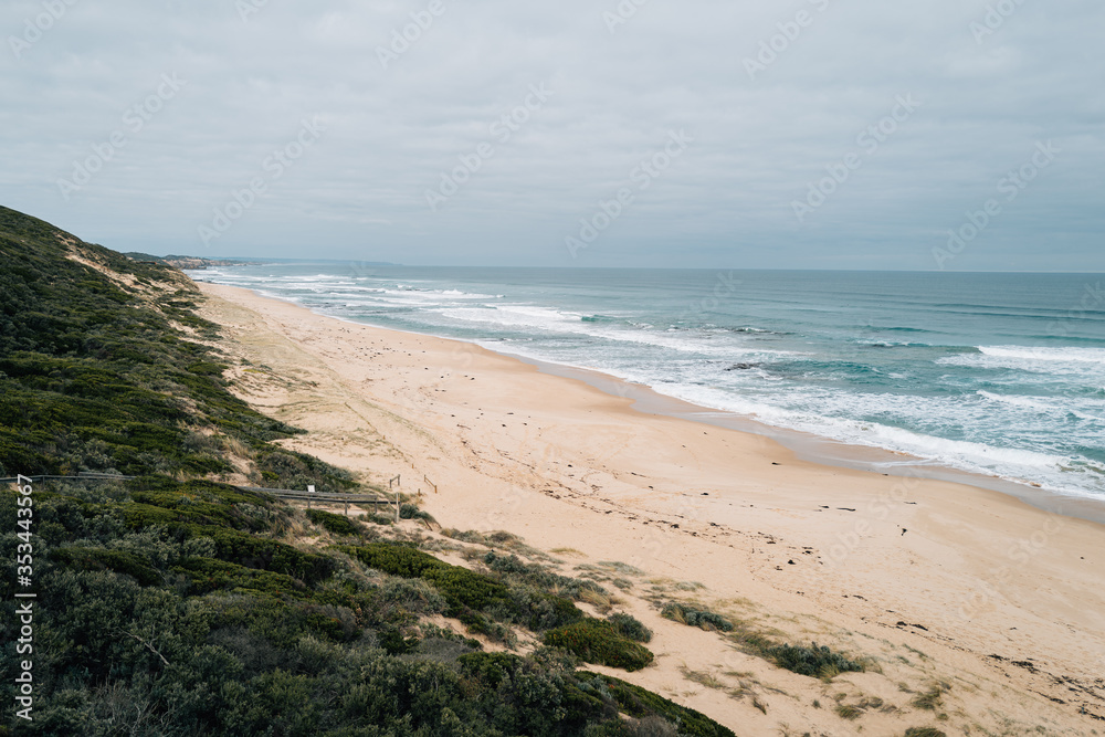 empty Australian beach on overcast day empty Australian beach on overcast day