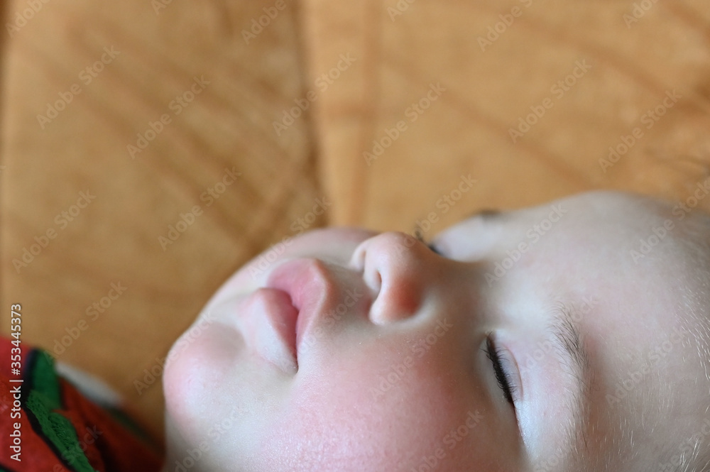 Fototapeta premium sleeping baby bottom view. Close-up of a sleeping baby.