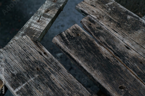 Old weathered wood surface with dark background