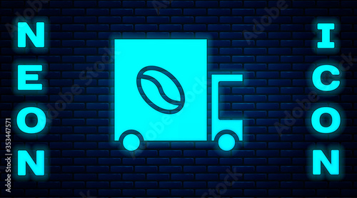Glowing neon Coffee street truck machine icon isolated on brick wall background. Delivery coffee. Vector Illustration.