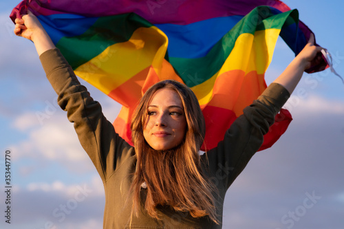 Photography woman raises flag gay pride