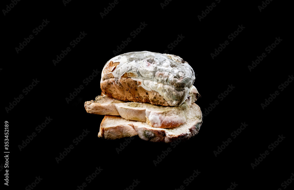 Beautiful moldy bread on black color background.healthy and food concepts Beautiful moldy bread on black color background.healthy and food concepts