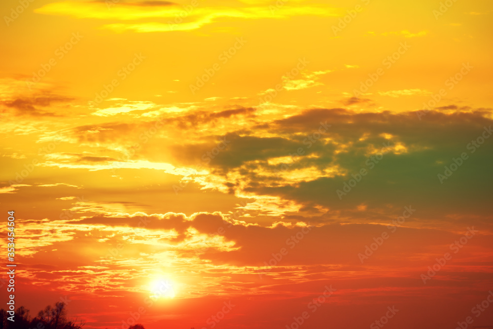Colorful cloudy sky at sunset. Blazing sunset, gradient color. Sky texture, abstract nature background