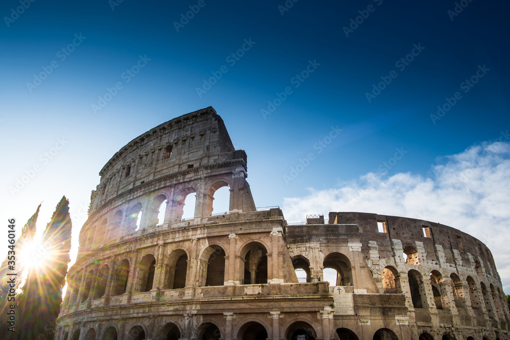 The Colosseum or Coliseum at sunrise in Rome Italy