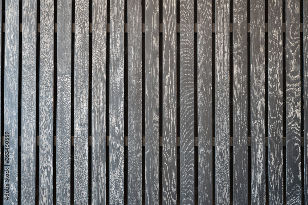 Fototapeta premium Black wooden battens with white scraping burrs. background texture interior design
