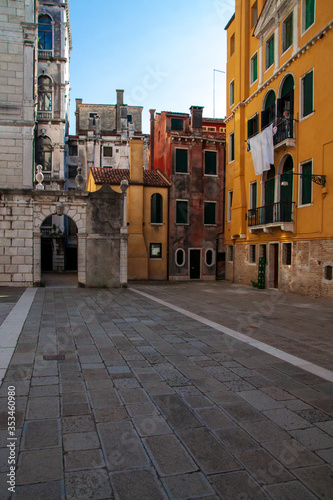 One of the Venetian squares, houses and stone slabs © Lukyan