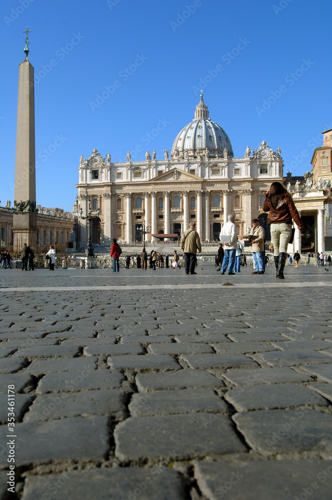 view from below and of the cobblestones in the square of St. Peter's basilica in Rome
