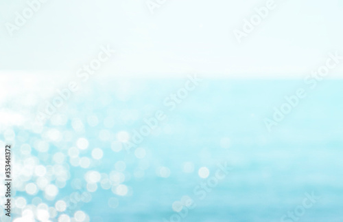 Blur tropical beach with bokeh sun light wave abstract background, Travel concept