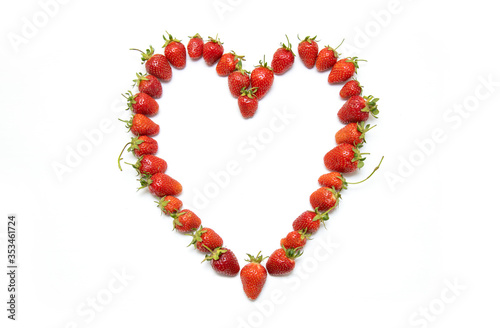 Top view, fresh strawberry in heart form symbol, isolated on white background. concept - love, diet and fruits.