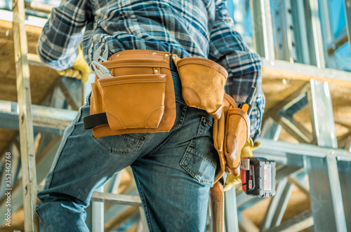 Construction Site Contractor on a Ladder