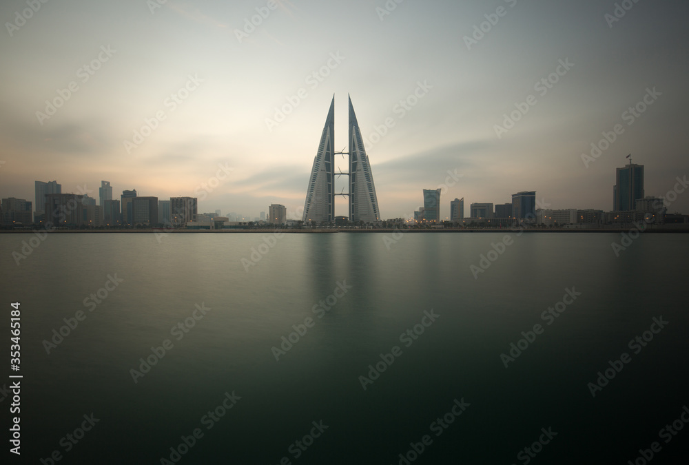 MANAMA, BAHRAIN - DECEMBER 30: The Bahrain World Trade Center during sunrise, a twin tower complex is the first skyscraper in the world to have wind turbines, December 30, 2017, Manama, Bahrain