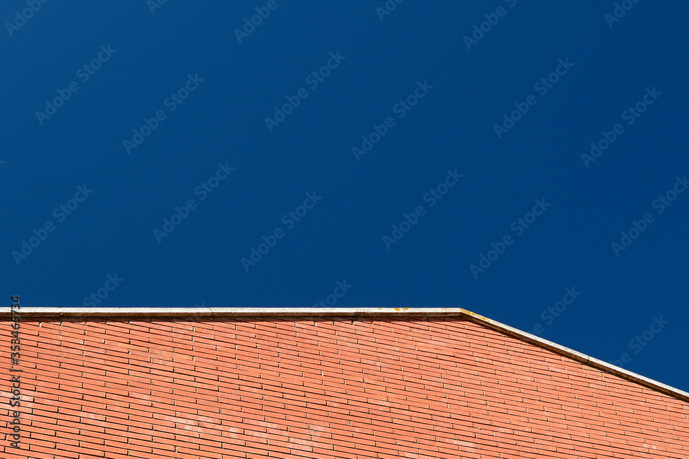 Red brick wall and blue sky Red brick wall and blue sky
