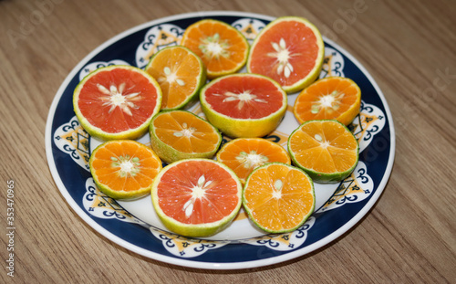 Beautiful lemons  bergamots and grapefruits cut in half on a cutting board.