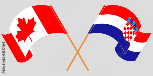 Crossed and waving flags of Croatia and Canada