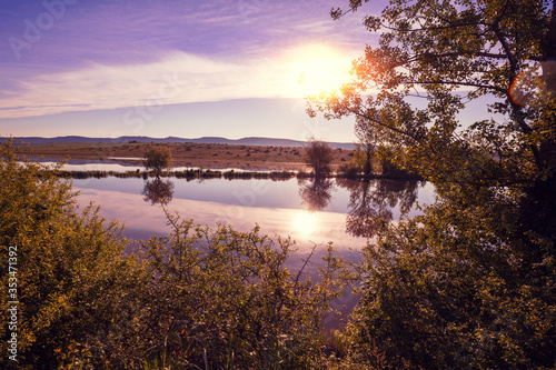 Magical sunset over the lake. Serene lake in the evening. Nature landscape.