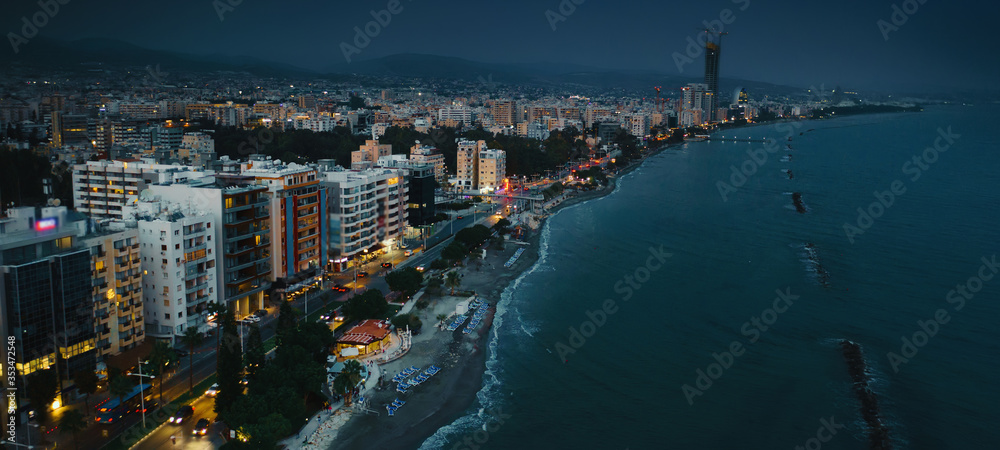 Fototapeta premium Aerial panorama of night Limassol waterfront, promenade Molos Park, Cyprus.