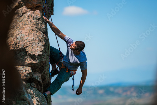 The climber climbs on a natural relief