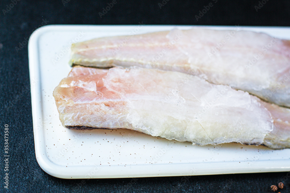 raw fish frozen fillet hake ice Menu concept healthy eating. food background top view copy space keto or paleo diet, pascarian raw fish frozen fillet hake ice Menu concept healthy eating. food background top view copy space keto or paleo diet, pascarian