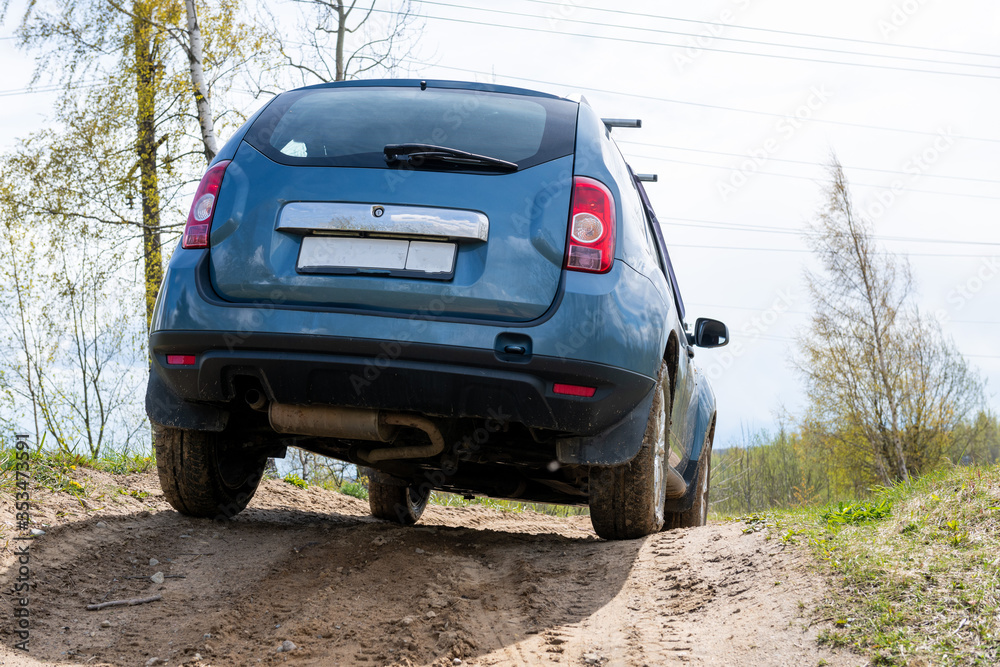 Dirty car on muddy road view from back. Off road concept. 4x4 Dirty car on muddy road view from back. Off road concept. 4x4